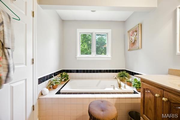 9 Sun Trail, Rise Trail, MO 63050 - bathroom featuring vanity and a garden tub