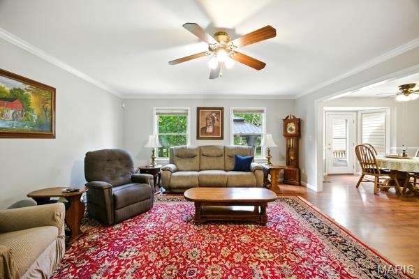 9 Sun Trail, Rise Trail, MO 63050 - living room with a ceiling fan, wood finished floors, and ornamental molding