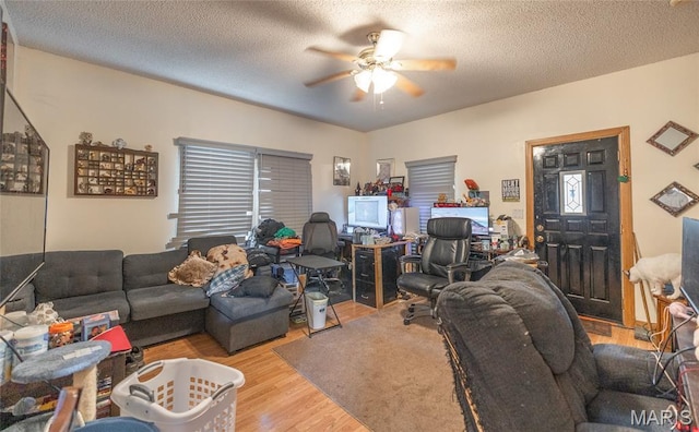 2008 Vienna Rd, Rolla, MO 65401 - living room with ceiling fan, wood finished floors, and a textured ceiling