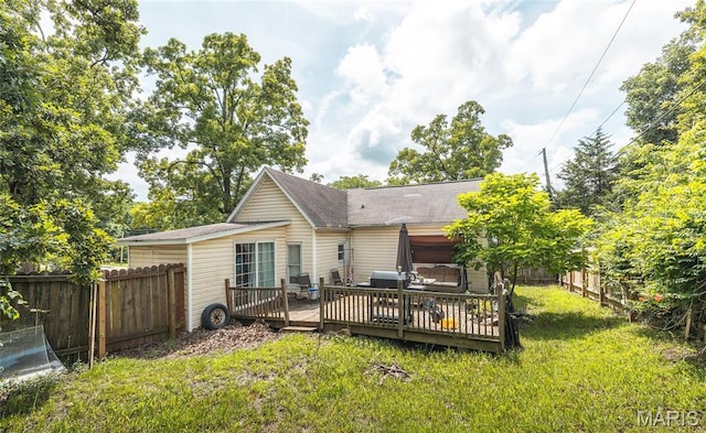 2008 Vienna Rd, Rolla, MO 65401 - back of house with a wooden deck, a fenced backyard, and roof with shingles