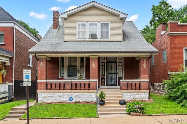 3623 Iowa Ave, Saint Louis, MO 63118 - bungalow-style house with a porch, brick siding, roof with shingles, and a chimney