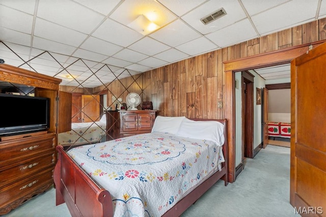 3623 Iowa Ave, Saint Louis, MO 63118 - carpeted bedroom featuring wood walls and a paneled ceiling