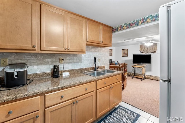 3623 Iowa Ave, Saint Louis, MO 63118 - kitchen with freestanding refrigerator, ceiling fan, light colored carpet, tasteful backsplash, and light tile patterned flooring