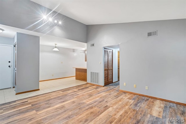 1308 Holgate Dr Unit G5, Ballwin, MO 63021 - unfurnished living room with light wood-style floors and high vaulted ceiling