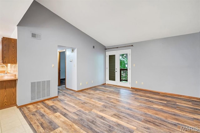 1308 Holgate Dr Unit G5, Ballwin, MO 63021 - unfurnished living room with high vaulted ceiling and light wood-type flooring