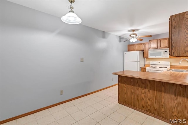 1308 Holgate Dr Unit G5, Ballwin, MO 63021 - kitchen featuring white appliances, a peninsula, a ceiling fan, brown cabinets, and hanging light fixtures