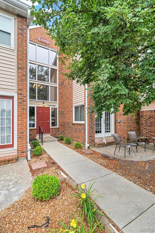 1308 Holgate Dr Unit G5, Ballwin, MO 63021 - property entrance with french doors and brick siding