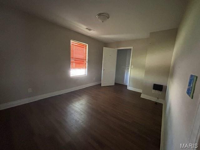 2069 State Highway H, Sikeston, MO 63801 - unfurnished bedroom with dark wood-style floors and baseboards