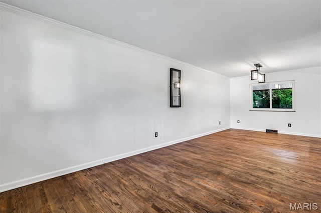 321 Fairview Ct, Ballwin, MO 63021 - unfurnished room with crown molding and dark wood-type flooring