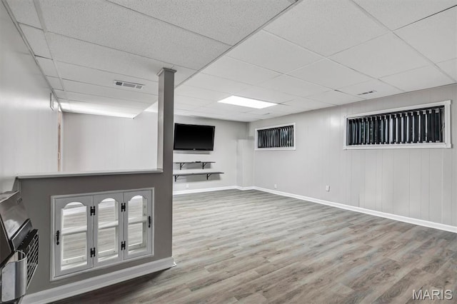 321 Fairview Ct, Ballwin, MO 63021 - finished basement with wood finished floors and a paneled ceiling
