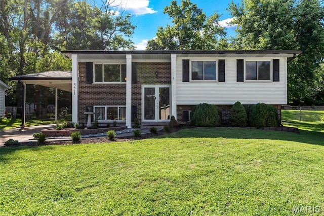 321 Fairview Ct, Ballwin, MO 63021 - raised ranch featuring brick siding, a carport, and concrete driveway