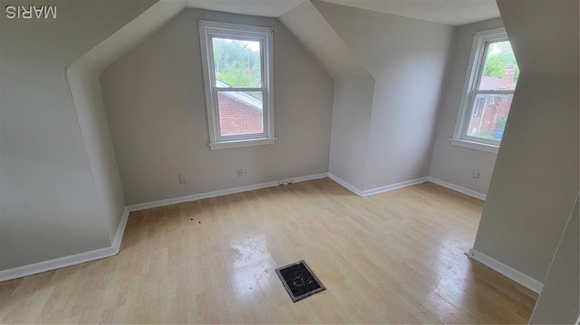 1938 Damato Ct, Jennings, MO 63136 - additional living space with wood finished floors and vaulted ceiling