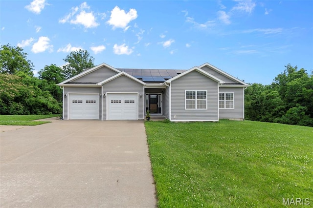 1638 County Road 642, Cape Girardeau, MO 63701 - ranch-style home featuring concrete driveway, an attached garage, solar panels, and a front yard