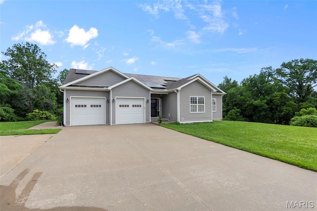 1638 County Road 642, Cape Girardeau, MO 63701 - ranch-style house featuring a garage, a front lawn, concrete driveway, and solar panels