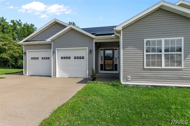 1638 County Road 642, Cape Girardeau, MO 63701 - single story home featuring driveway, an attached garage, roof mounted solar panels, and a front lawn