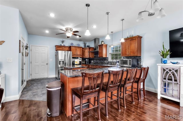 1638 County Road 642, Cape Girardeau, MO 63701 - kitchen with stainless steel appliances, brown cabinets, dark wood finished floors, baseboards, and recessed lighting