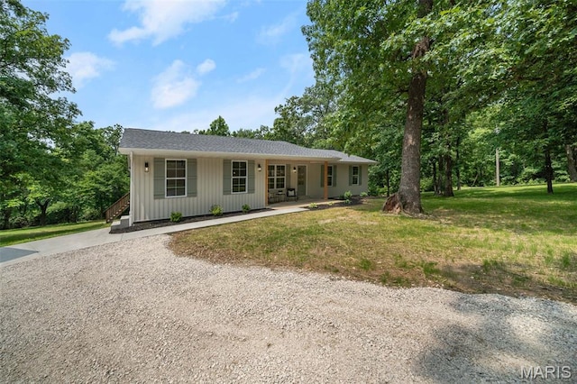 178 Spring Branch Rd, Troy, MO 63379 - single story home featuring a front lawn, a porch, and board and batten siding