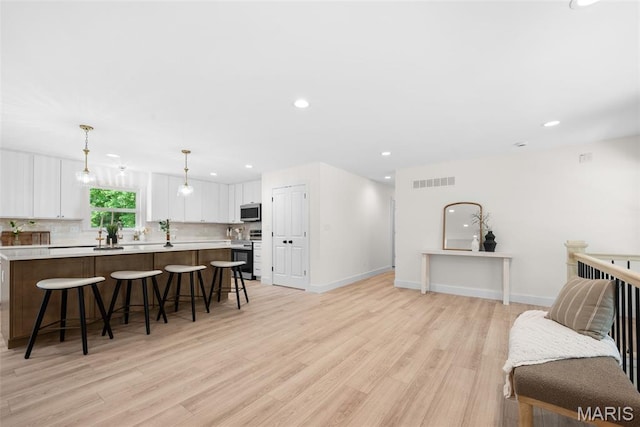 178 Spring Branch Rd, Troy, MO 63379 - living room featuring light wood-style flooring and recessed lighting
