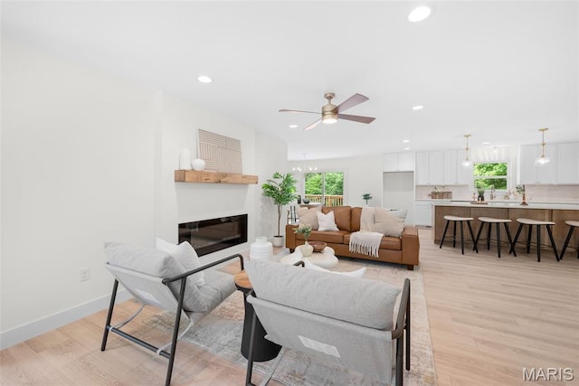 178 Spring Branch Rd, Troy, MO 63379 - living room featuring healthy amount of natural light, ceiling fan, light wood-style floors, recessed lighting, and a glass covered fireplace