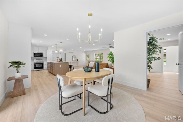 178 Spring Branch Rd, Troy, MO 63379 - dining space with a chandelier, a ceiling fan, light wood-style flooring, and recessed lighting