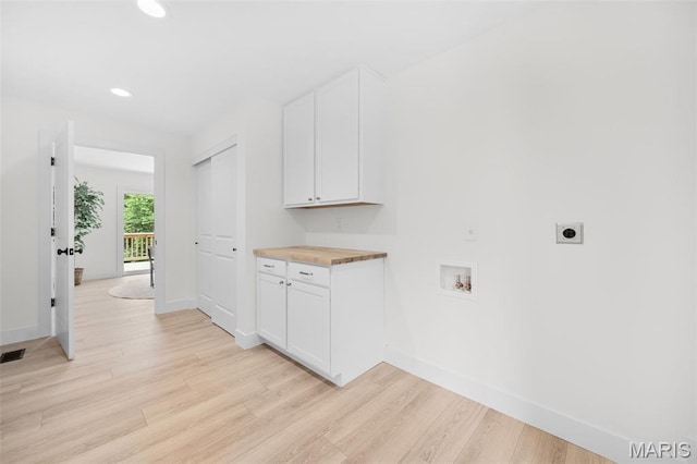 178 Spring Branch Rd, Troy, MO 63379 - washroom with electric dryer hookup, hookup for a washing machine, light wood-style flooring, recessed lighting, and cabinet space