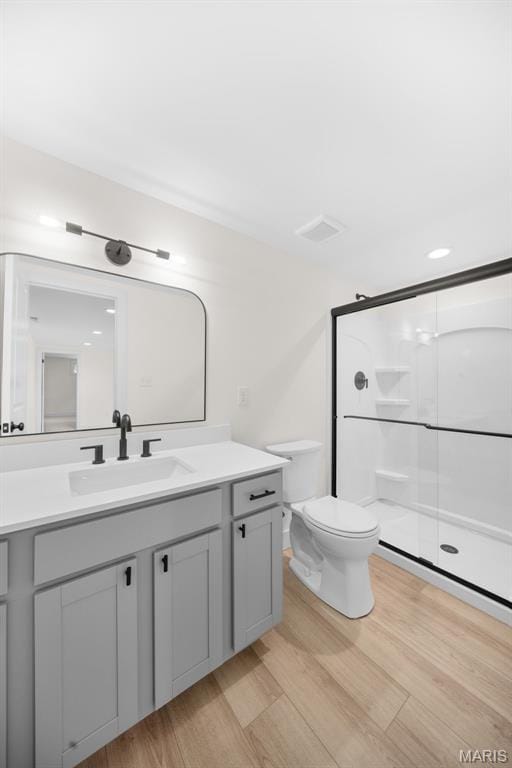 178 Spring Branch Rd, Troy, MO 63379 - bathroom featuring vanity, wood finished floors, and a shower stall