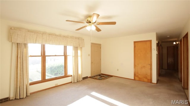 517 N 11th, De Soto, MO 63020 - spare room with light colored carpet and a ceiling fan