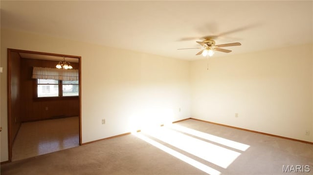 517 N 11th, De Soto, MO 63020 - spare room with a chandelier, carpet flooring, and a ceiling fan