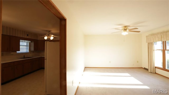 517 N 11th, De Soto, MO 63020 - unfurnished room featuring ceiling fan and light carpet