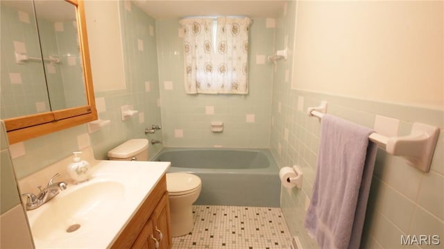 517 N 11th, De Soto, MO 63020 - full bath with tile walls, vanity, tile patterned floors, and shower / bath combination