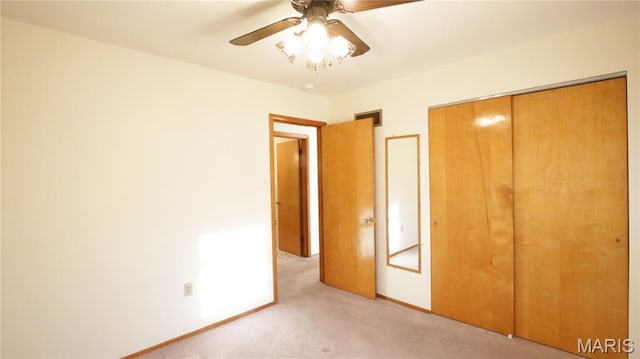 517 N 11th, De Soto, MO 63020 - unfurnished bedroom with light colored carpet, a closet, and a ceiling fan