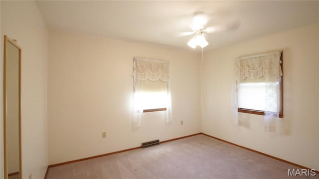 517 N 11th, De Soto, MO 63020 - empty room featuring plenty of natural light and light colored carpet