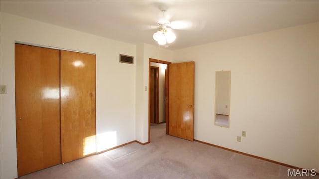 517 N 11th, De Soto, MO 63020 - unfurnished bedroom featuring carpet floors, a closet, and ceiling fan