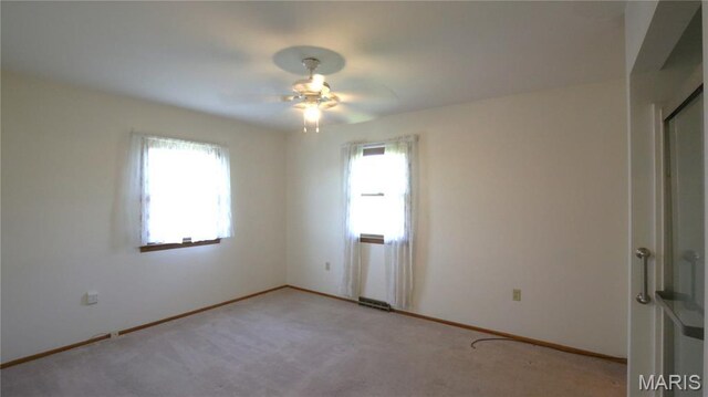 517 N 11th, De Soto, MO 63020 - spare room featuring a ceiling fan and light carpet