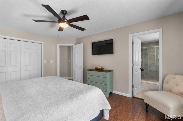 757 N W Ln, Jackson, MO 63755 - bedroom with dark wood finished floors, a closet, ceiling fan, ensuite bathroom, and a textured ceiling