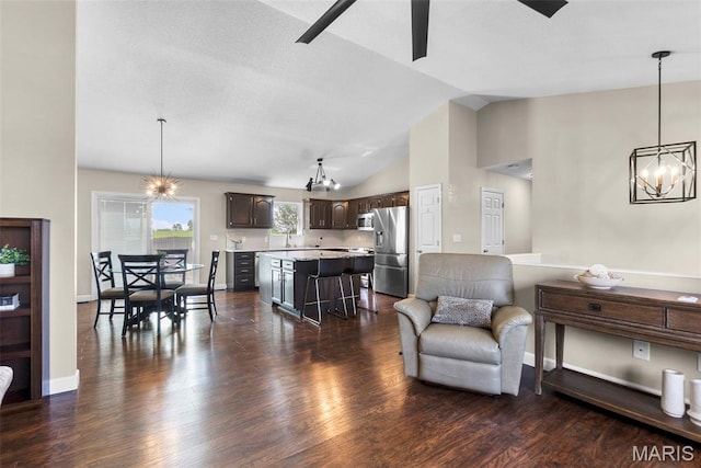 757 N W Ln, Jackson, MO 63755 - living area with a chandelier, dark wood-style flooring, ceiling fan, and high vaulted ceiling