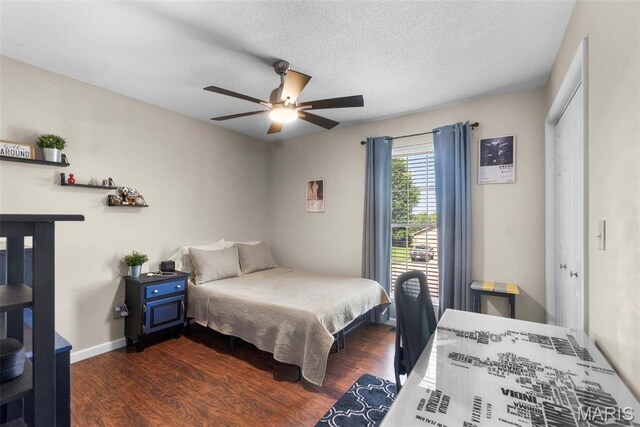 757 N W Ln, Jackson, MO 63755 - bedroom with dark wood-style flooring, a closet, a textured ceiling, and a ceiling fan