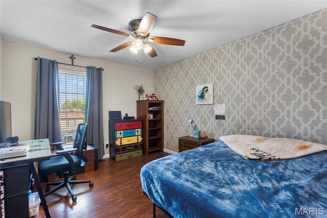 757 N W Ln, Jackson, MO 63755 - bedroom with wallpapered walls, wood finished floors, a desk, a ceiling fan, and an accent wall