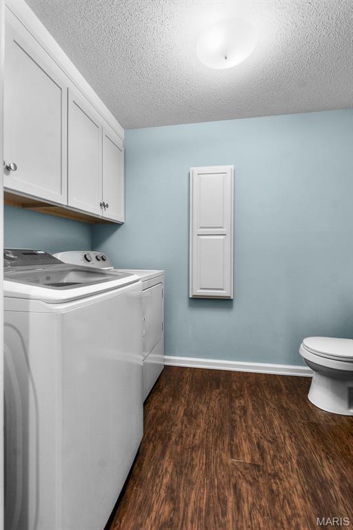 757 N W Ln, Jackson, MO 63755 - laundry room with independent washer and dryer, dark wood finished floors, and a textured ceiling