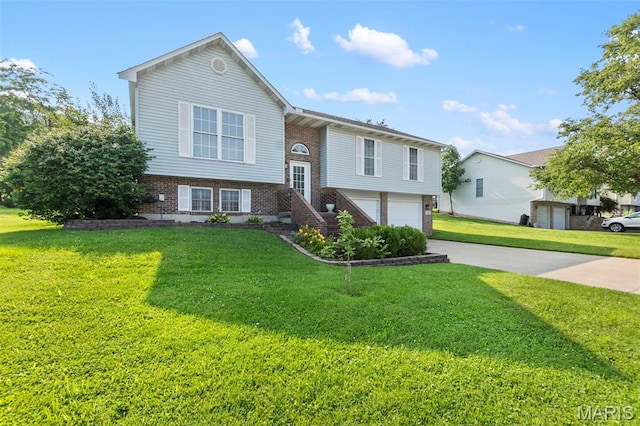 757 N W Ln, Jackson, MO 63755 - bi-level home with brick siding, driveway, an attached garage, and a front lawn