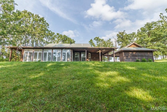 19395 Ripley Dr, Lebanon, MO 65536 - back of house with a sunroom and a yard