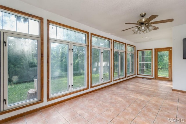 19395 Ripley Dr, Lebanon, MO 65536 - unfurnished sunroom featuring tile patterned floors and baseboards