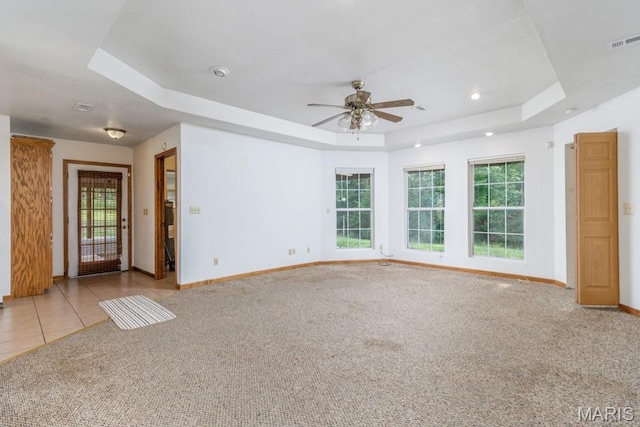 19395 Ripley Dr, Lebanon, MO 65536 - carpeted spare room with a raised ceiling, baseboards, ceiling fan, and recessed lighting