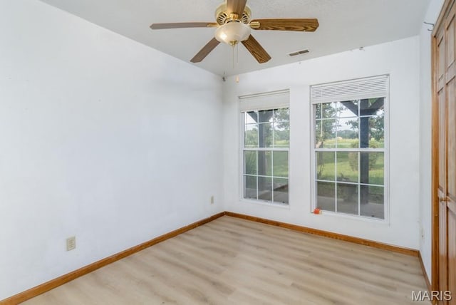 19395 Ripley Dr, Lebanon, MO 65536 - empty room featuring light wood finished floors, baseboards, and ceiling fan