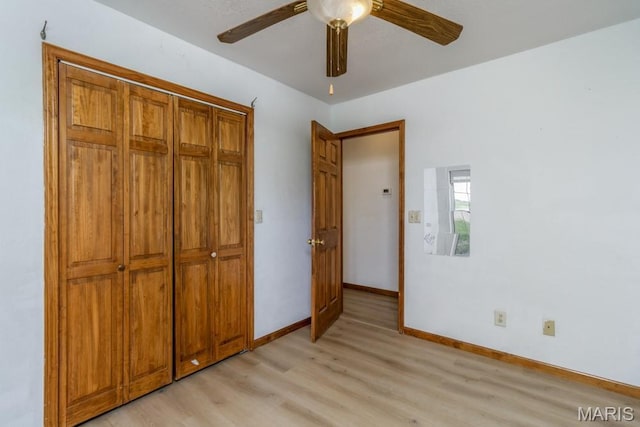 19395 Ripley Dr, Lebanon, MO 65536 - unfurnished bedroom featuring light wood finished floors, baseboards, a ceiling fan, and a closet