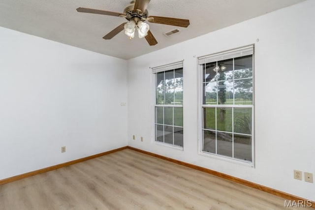 19395 Ripley Dr, Lebanon, MO 65536 - empty room featuring light wood-style floors, baseboards, and a ceiling fan