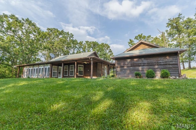 19395 Ripley Dr, Lebanon, MO 65536 - rear view of house featuring a lawn