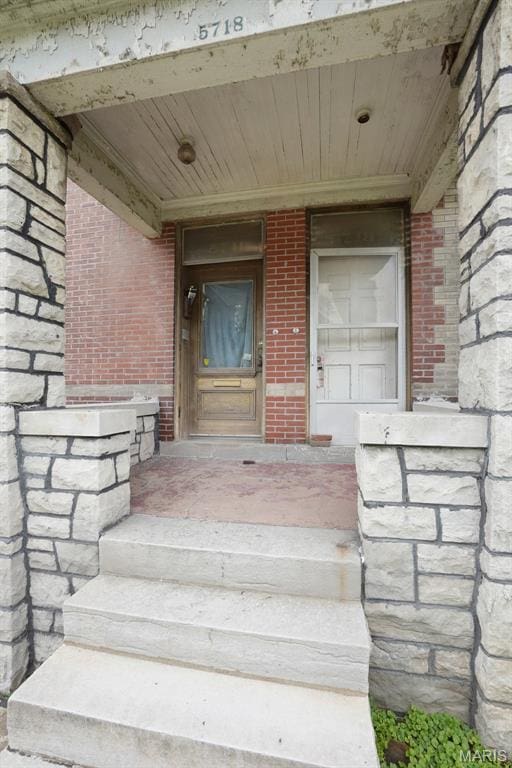 5718 Etzel Ave, Saint Louis, MO 63112 - property entrance featuring brick siding and covered porch
