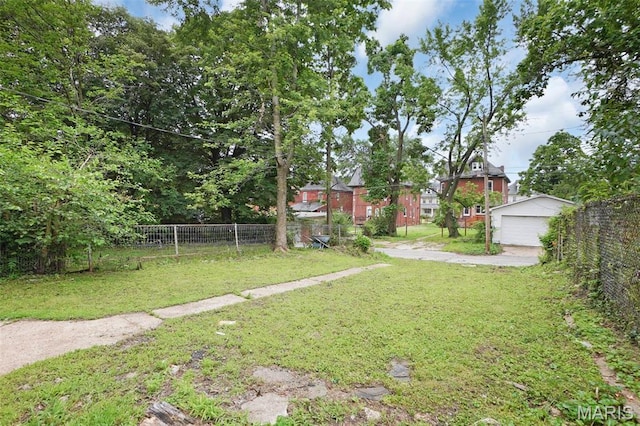 5718 Etzel Ave, Saint Louis, MO 63112 - view of yard featuring a garage and an outbuilding