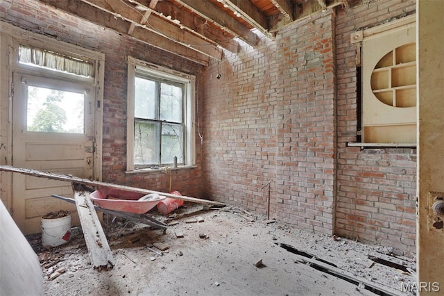 5718 Etzel Ave, Saint Louis, MO 63112 - misc room with healthy amount of natural light and brick wall